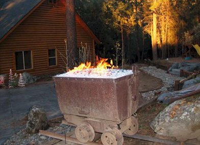 fireglass firepit feature mine car Dallas TX  www.grasshopperslandscapingllc.com